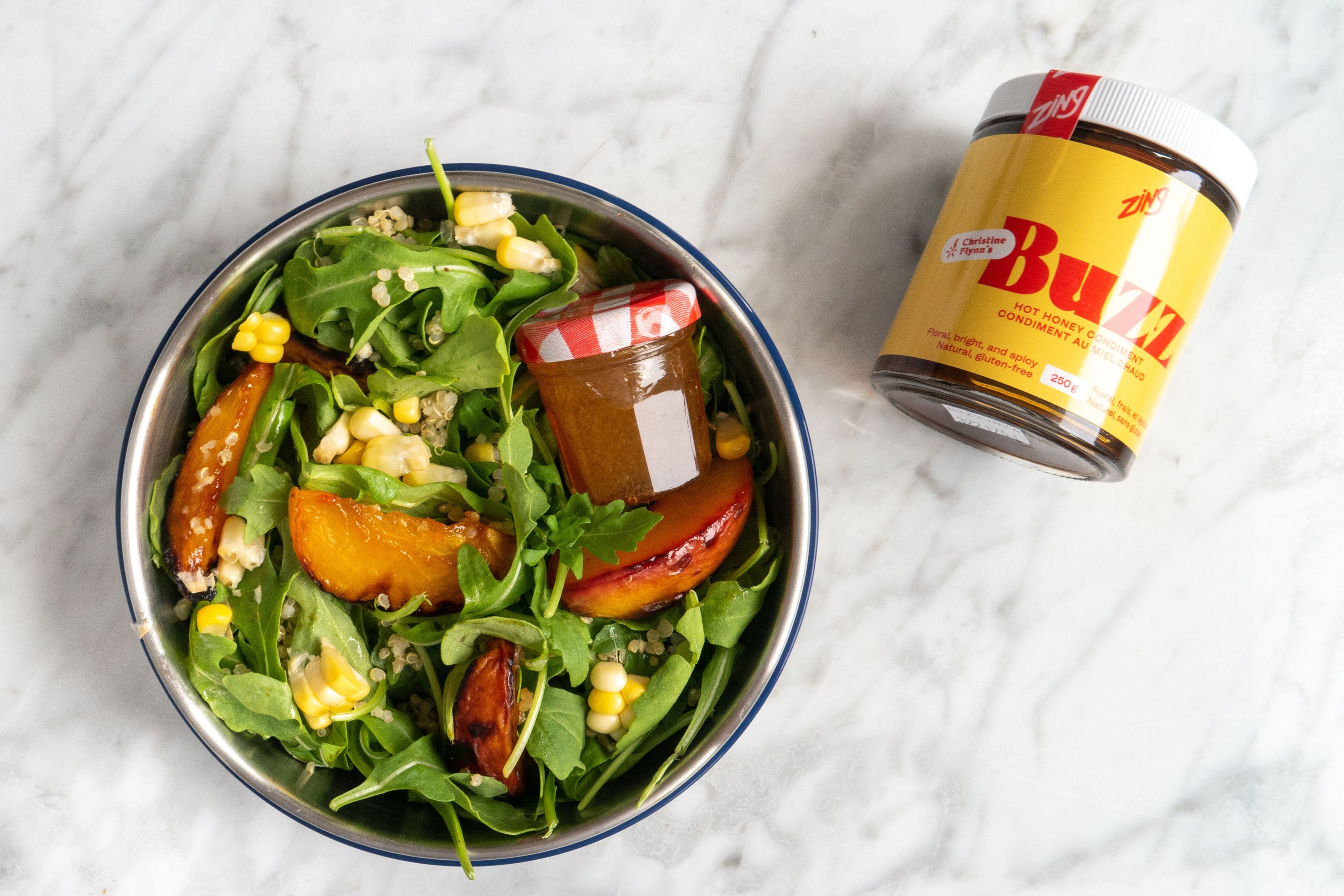 Bruleed Peach, Arugula, Corn and Quinoa Salad featuring Buzz Hot Honey