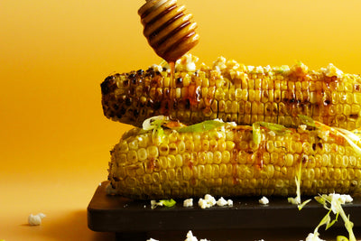 Grilled Sweet Corn on the Cob with Hot Honey Butter and Feta
